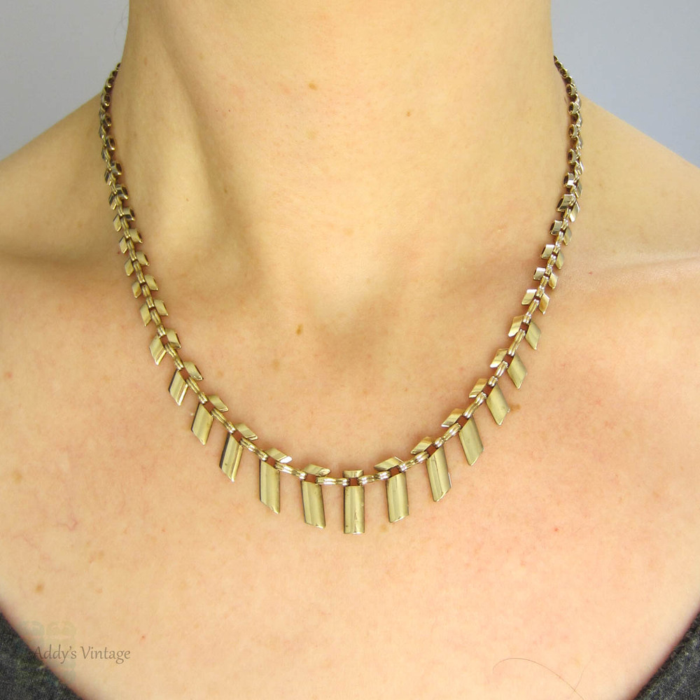 Sold at Auction: A section of gold 'Cleopatra' style fringe necklace,