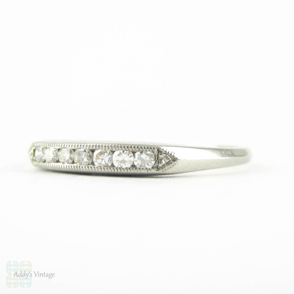 Art Deco Diamond Half Hoop Wedding Ring. Channel Set Seven Stone Platinum Ring with Milgrain Beading. Circa 1930s.