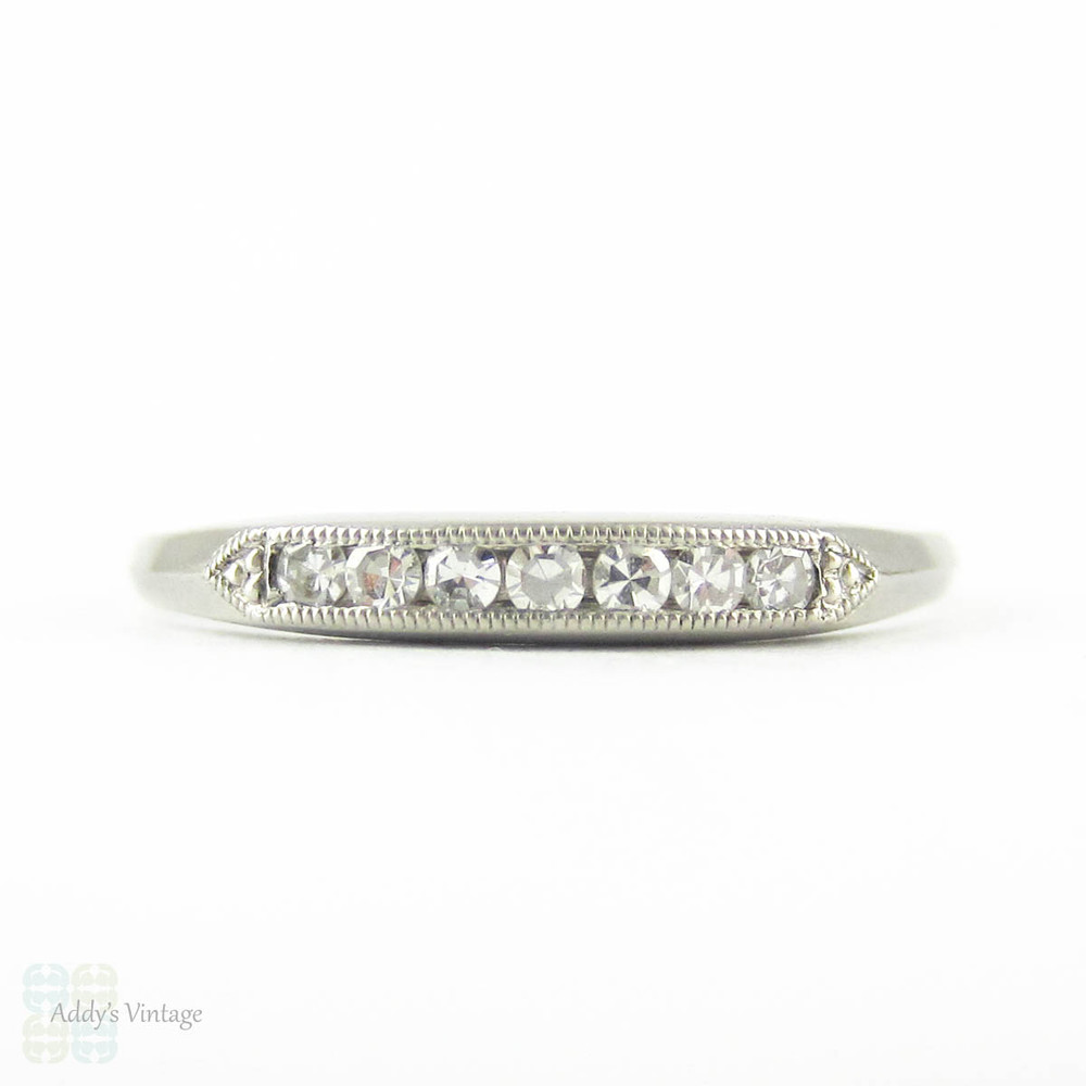 Art Deco Diamond Half Hoop Wedding Ring. Channel Set Seven Stone Platinum Ring with Milgrain Beading. Circa 1930s.