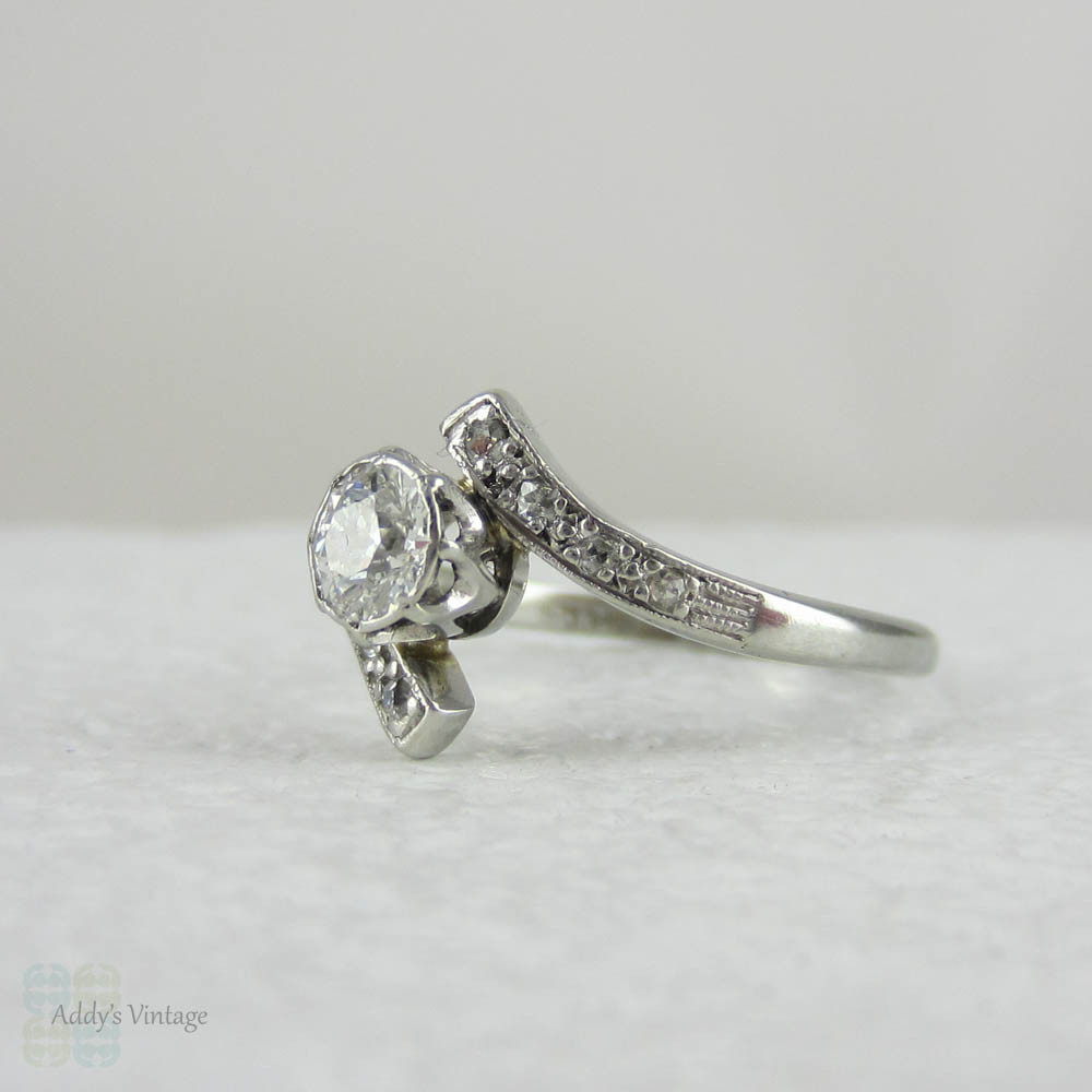 Antique Diamond Engagement Ring. Old European Cut Diamond in White Gold Bypass Style Setting, Circa Early 1900s.