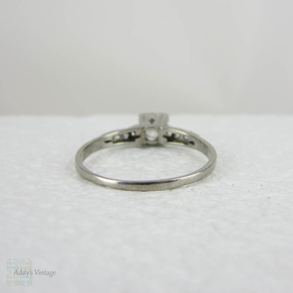 Antique Platinum Engagement Ring with European Cut Diamond in Triple Claw Fishtail Style Setting.Cathedral Setting, Circa 1920s.