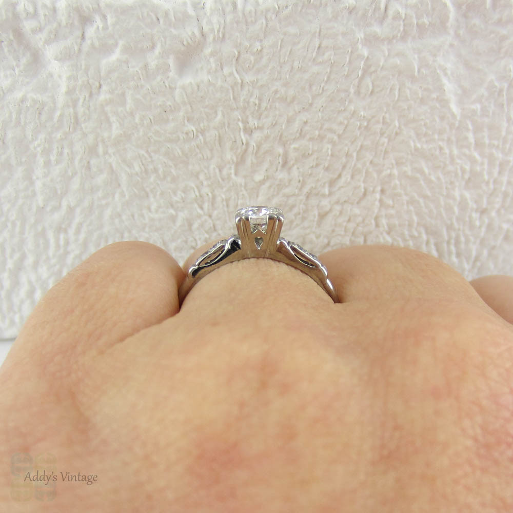 Antique Platinum Engagement Ring with European Cut Diamond in Triple Claw Fishtail Style Setting.Cathedral Setting, Circa 1920s.