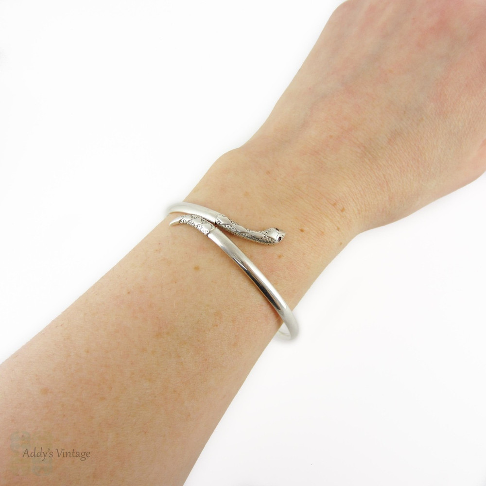 Vintage Silver Snake Bracelet with Garnet Eyes. Sterling Coiled Serpent Bangle. Mid 20th Century.
