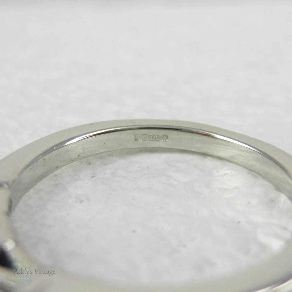 Estate Platinum Round Brilliant Diamond Engagement Ring with Tapered Baguette Accent Diamonds.