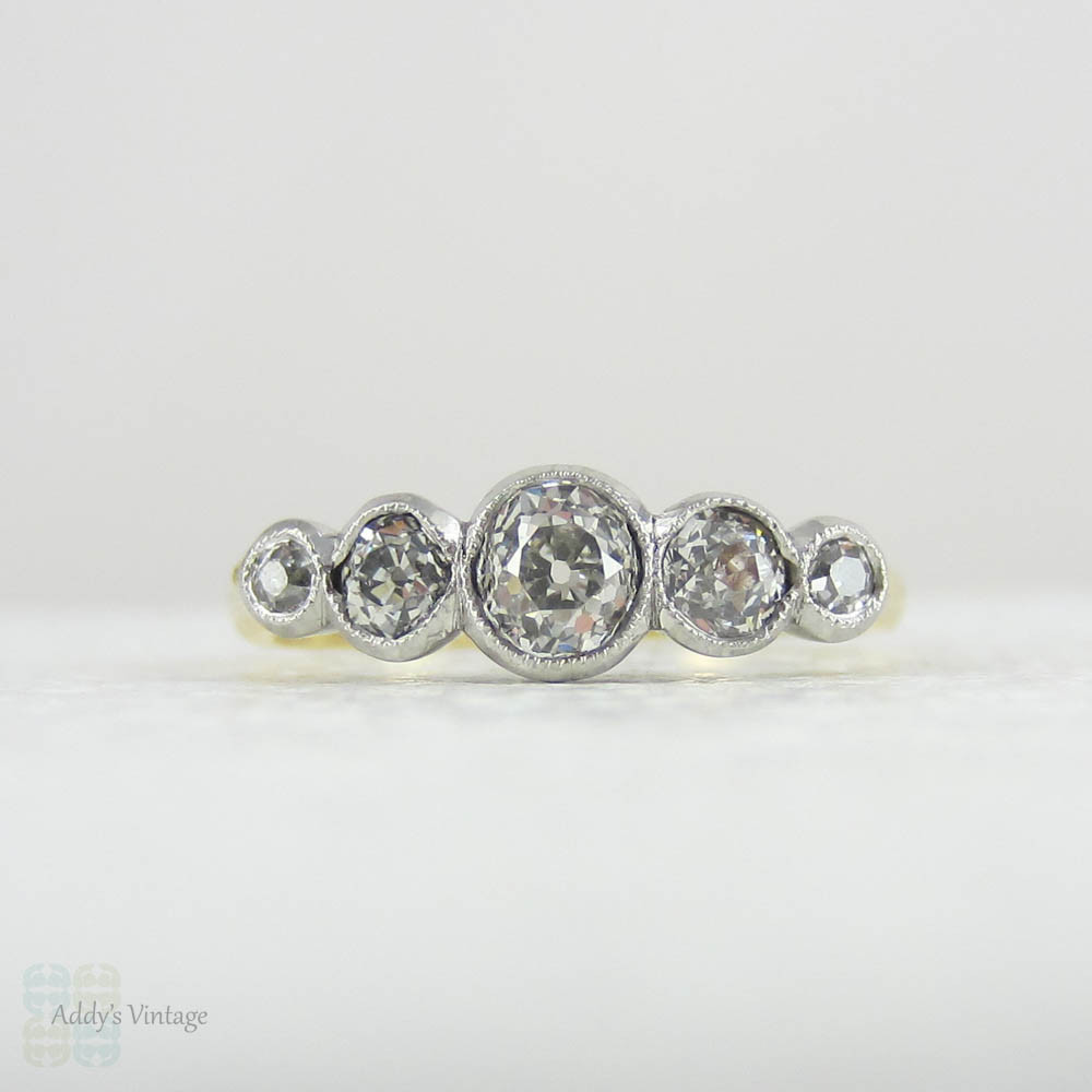 Antique Five Stone Old Mine Cut Diamond Engagement Ring. Graduated Diamonds Bezel Set in Miligrain Lined Platinum Topped 18 Carat Yellow Gold.