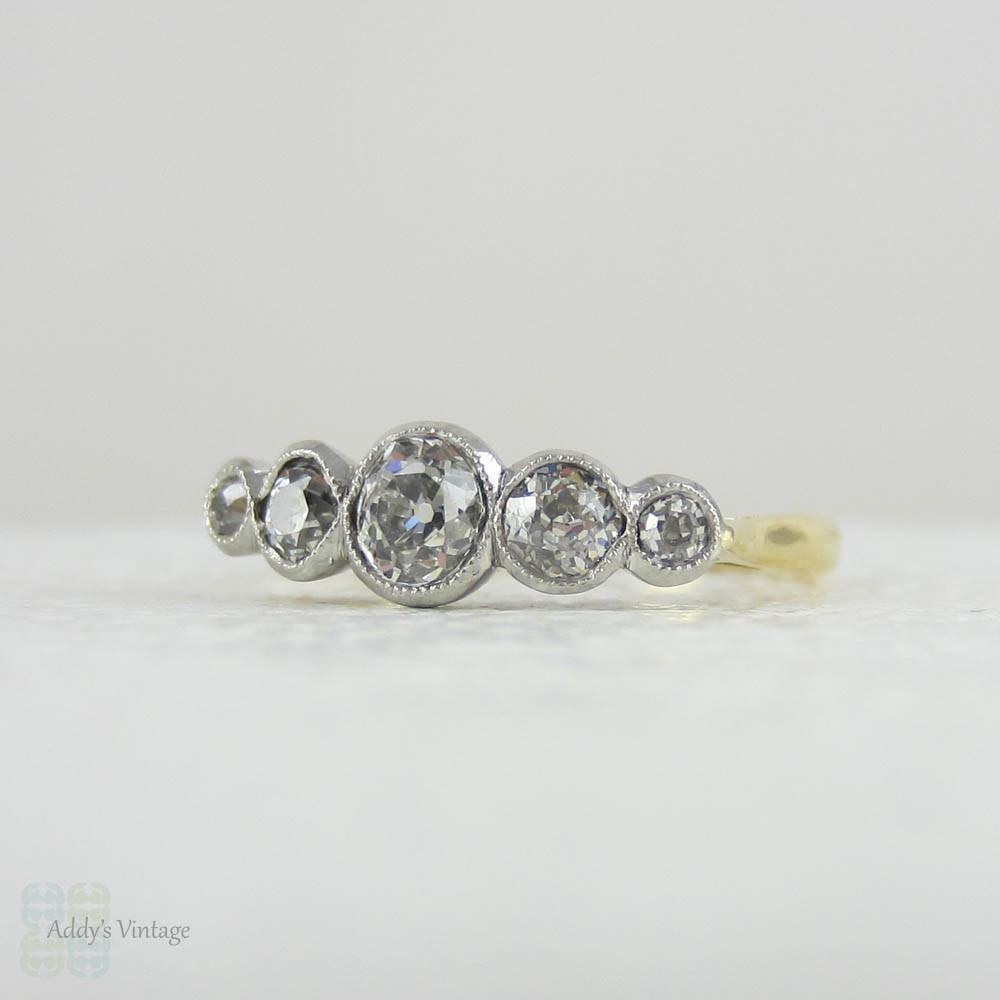 Antique Five Stone Old Mine Cut Diamond Engagement Ring. Graduated Diamonds Bezel Set in Miligrain Lined Platinum Topped 18 Carat Yellow Gold.