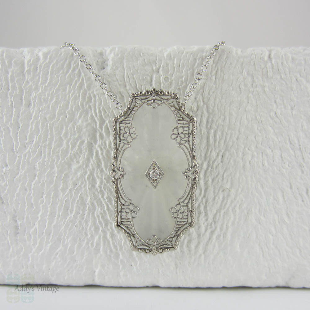 Art Deco Pendant. Camphor Glass, Diamond and White Gold Filigree Necklace. Lacey Floral Filigree with Milgrain Detail, Circa 1920s.