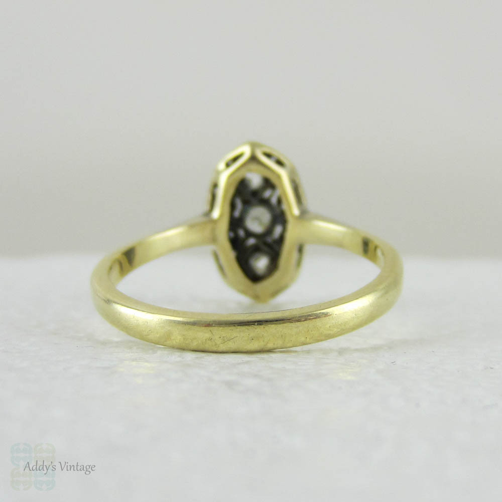 Art Deco Navette Shaped Old Mine Cut Diamond Ring with Geometric Design Pierced Filigree in Two-Tone Gold, Circa 1920s.