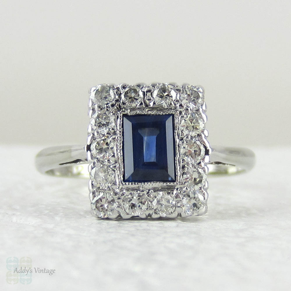 Art Deco Sapphire & Diamond Engagement Ring. Emerald Cut Blue Sapphire with Transitional Cut Diamond Halo in 18 Carat Gold & Platinum.
