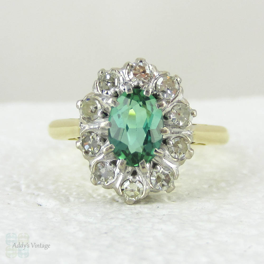 Vintage Green Tourmaline Ring with Diamond Halo, 18 Carat Gold Engagement Ring or Dress Ring, Circa 1940s.