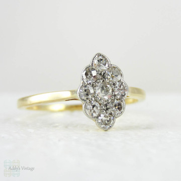 Vintage Pave Set Diamond Cluster Ring, Marquise Shape 9 Stone Old Cut Diamond Panel Ring in 18 Carat Gold, Circa 1910s.