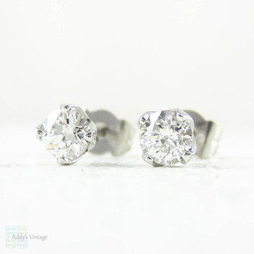 Old European Cut Diamond Stud Earrings in Platinum. Vintage 0.70 ctw Diamonds Set in Modern Petal Shaped 4 Claw Platinum Mounts.