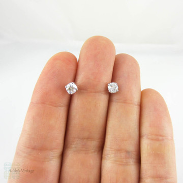 Old European Cut Diamond Stud Earrings in Platinum. Vintage 0.70 ctw Diamonds Set in Modern Petal Shaped 4 Claw Platinum Mounts.