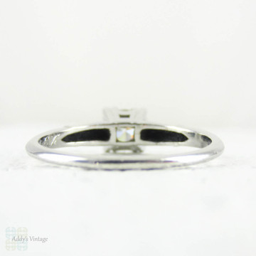 Transitional Cut Diamond Engagement Ring, Tapered Baguette Platinum Setting with Triple Claw Style Prongs, 0.86 ctw, Circa 1930s.