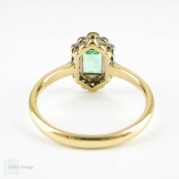 Art Deco Emerald & Diamond Engagement Ring. Light Green Emerald Cut Emerald with Fan Shaped Diamond Halo. Circa 1920s, 18ct & Platinum.