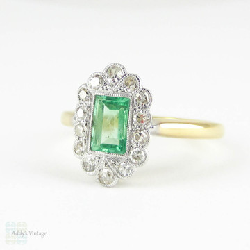Art Deco Emerald & Diamond Engagement Ring. Light Green Emerald Cut Emerald with Fan Shaped Diamond Halo. Circa 1920s, 18ct & Platinum.