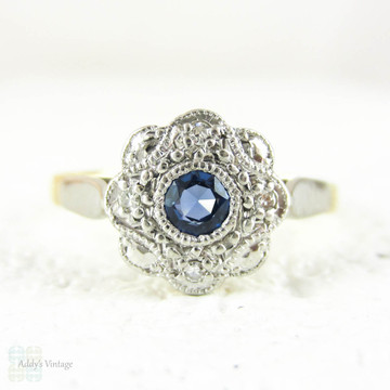 Sapphire & Diamond Daisy Engagement Ring, Blue Sapphire in Floral Shape Diamond Halo with Milgrain. Circa 1930s, 18ct & Platinum.