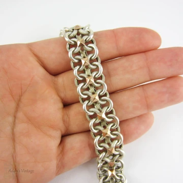 Vintage French Bracelet, Sterling Silver Alternating Beaded Texture & Shiny Figure 8 Links with 9 Carat Rose Gold Accents. Circa 1940s.