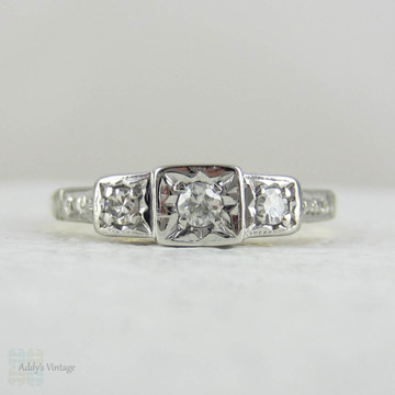 Art Deco Diamond Engagement Ring. Three Stone Trilogy Ring with Engraved Shoulders in Yellow Gold with Platinum Top, Circa 1920s.