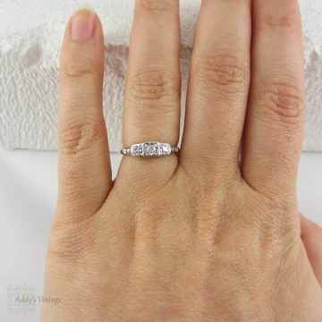 Art Deco Diamond Engagement Ring. Three Stone Trilogy Ring with Engraved Shoulders in Yellow Gold with Platinum Top, Circa 1920s.