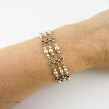 Vintage Cultured Pearl Bracelet, Graduated Triple Row Design in 9 Carat White Gold. Circa 1940s.