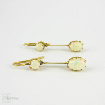 Antique Opal Dangle Earrings, Double Oval Cabochon Cut Opal. Circa 1900s, 9 Carat Yellow Gold.