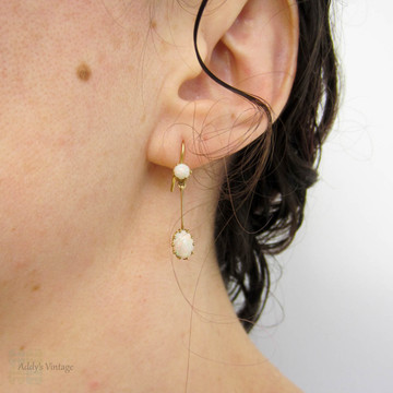 Antique Opal Dangle Earrings, Double Oval Cabochon Cut Opal. Circa 1900s, 9 Carat Yellow Gold.