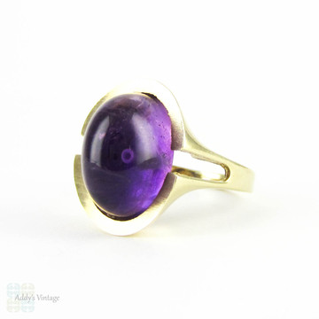 Modernist Amethyst Cocktail Ring, Royal Purple Cabochon Cut Amethyst in 8 Carat Gold Convex Split Shape Setting. Circa 1960s.