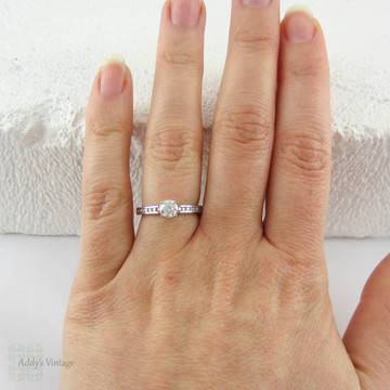 Round Brilliant Diamond Engagement Ring with Channel Set Side Stones in 18 Carat White Gold. Classic Style Estate Diamond Ring.