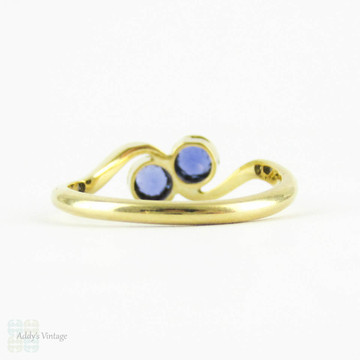 Vintage Sapphire Toi et Moi Engagement Ring, Cornflower Blue Bezel Set Sapphires in Bypass Design Setting. 18 Carat Gold, Circa 1920s.