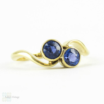 Vintage Sapphire Toi et Moi Engagement Ring, Cornflower Blue Bezel Set Sapphires in Bypass Design Setting. 18 Carat Gold, Circa 1920s.