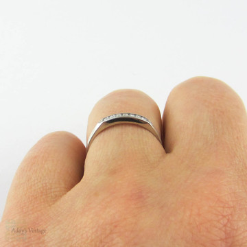 Art Deco Diamond Half Hoop Wedding Ring. Channel Set Seven Stone Platinum Ring with Milgrain Beading. Circa 1930s.