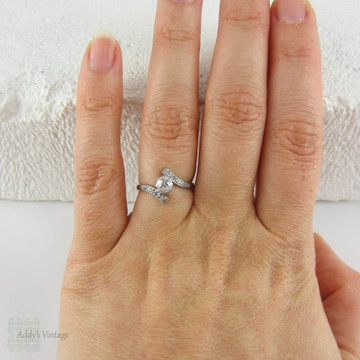 Antique Diamond Engagement Ring. Old European Cut Diamond in White Gold Bypass Style Setting, Circa Early 1900s.