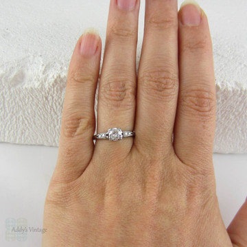 Antique Platinum Engagement Ring with European Cut Diamond in Triple Claw Fishtail Style Setting.Cathedral Setting, Circa 1920s.