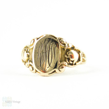 Art Deco Signet Ring by Ostby Barton, 10k Yellow Gold "RMW" Ladies Signet Ring with Engraved Flowers Circa 1920s.
