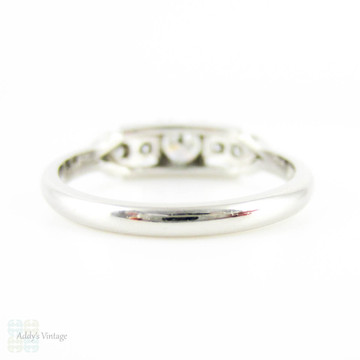 Mid 20th Century Diamond Engagement Ring, Round Brilliant Cut Diamond in Bow Style Platinum Setting. 0.31 ctw, Circa 1940s.