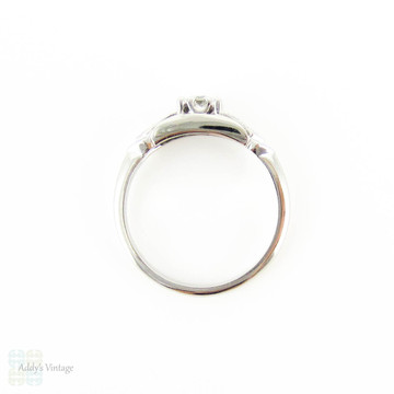 Mid 20th Century Diamond Engagement Ring, Round Brilliant Cut Diamond in Bow Style Platinum Setting. 0.31 ctw, Circa 1940s.