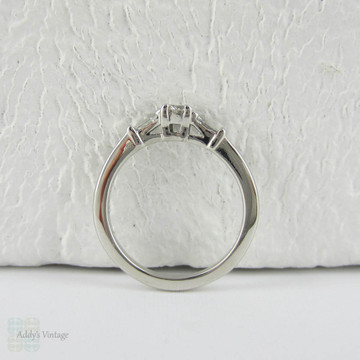 Estate Platinum Round Brilliant Diamond Engagement Ring with Tapered Baguette Accent Diamonds.