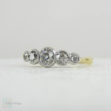 Antique Five Stone Old Mine Cut Diamond Engagement Ring. Graduated Diamonds Bezel Set in Miligrain Lined Platinum Topped 18 Carat Yellow Gold.