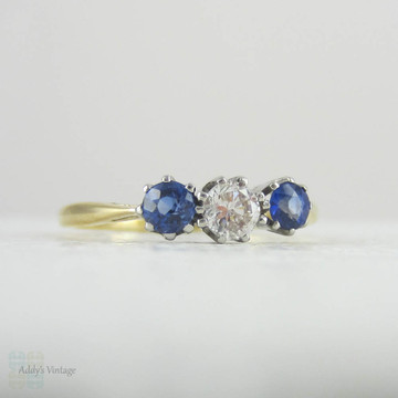 Vintage Diamond & Sapphire Three Stone Engagement Ring. Trilogy Ring with Round Brilliant Cut Diamond and Cornflower Blue Sapphire.