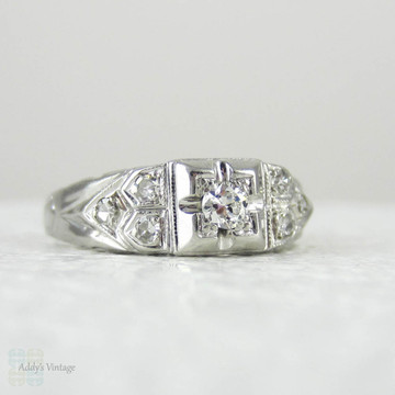 Art Deco Platinum Diamond Engagement Ring. Transitional Cut Diamond in Stepped Design Filigree Setting, 1930s.