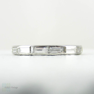 Art Deco Baguette Diamond Eternity Ring. Full Hoop Eternity Platinum Wedding Ring, Channel Set Baguettes, Circa 1920s.