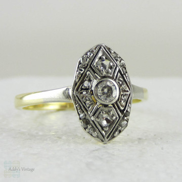 Art Deco Navette Shaped Old Mine Cut Diamond Ring with Geometric Design Pierced Filigree in Two-Tone Gold, Circa 1920s.