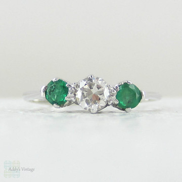 European Diamond & Light Green Emerald Engagement Ring. Antique Trilogy Ring set in White Gold, Early 20th Century.