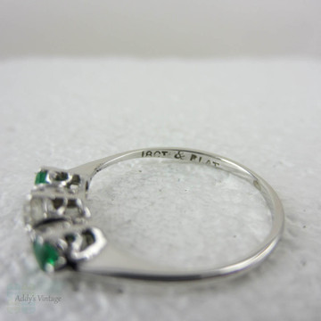 European Diamond & Light Green Emerald Engagement Ring. Antique Trilogy Ring set in White Gold, Early 20th Century.