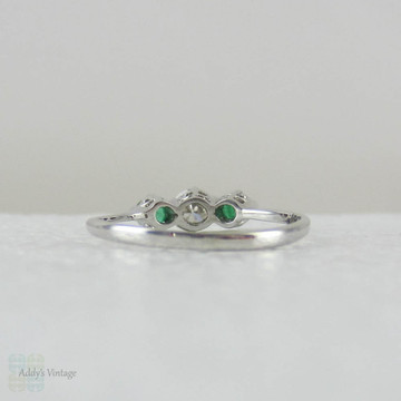 European Diamond & Light Green Emerald Engagement Ring. Antique Trilogy Ring set in White Gold, Early 20th Century.