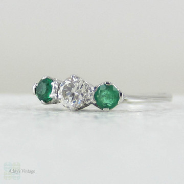 European Diamond & Light Green Emerald Engagement Ring. Antique Trilogy Ring set in White Gold, Early 20th Century.