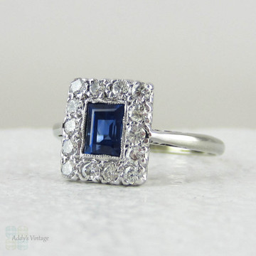 Art Deco Sapphire & Diamond Engagement Ring. Emerald Cut Blue Sapphire with Transitional Cut Diamond Halo in 18 Carat Gold & Platinum.