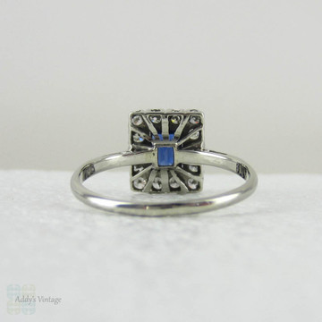Art Deco Sapphire & Diamond Engagement Ring. Emerald Cut Blue Sapphire with Transitional Cut Diamond Halo in 18 Carat Gold & Platinum.