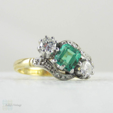 Emerald & Diamond Engagement Ring, Art Deco Twist Style Emerald Cut Green Emerald with Round Brilliant Cut Diamonds, Circa 1930s.